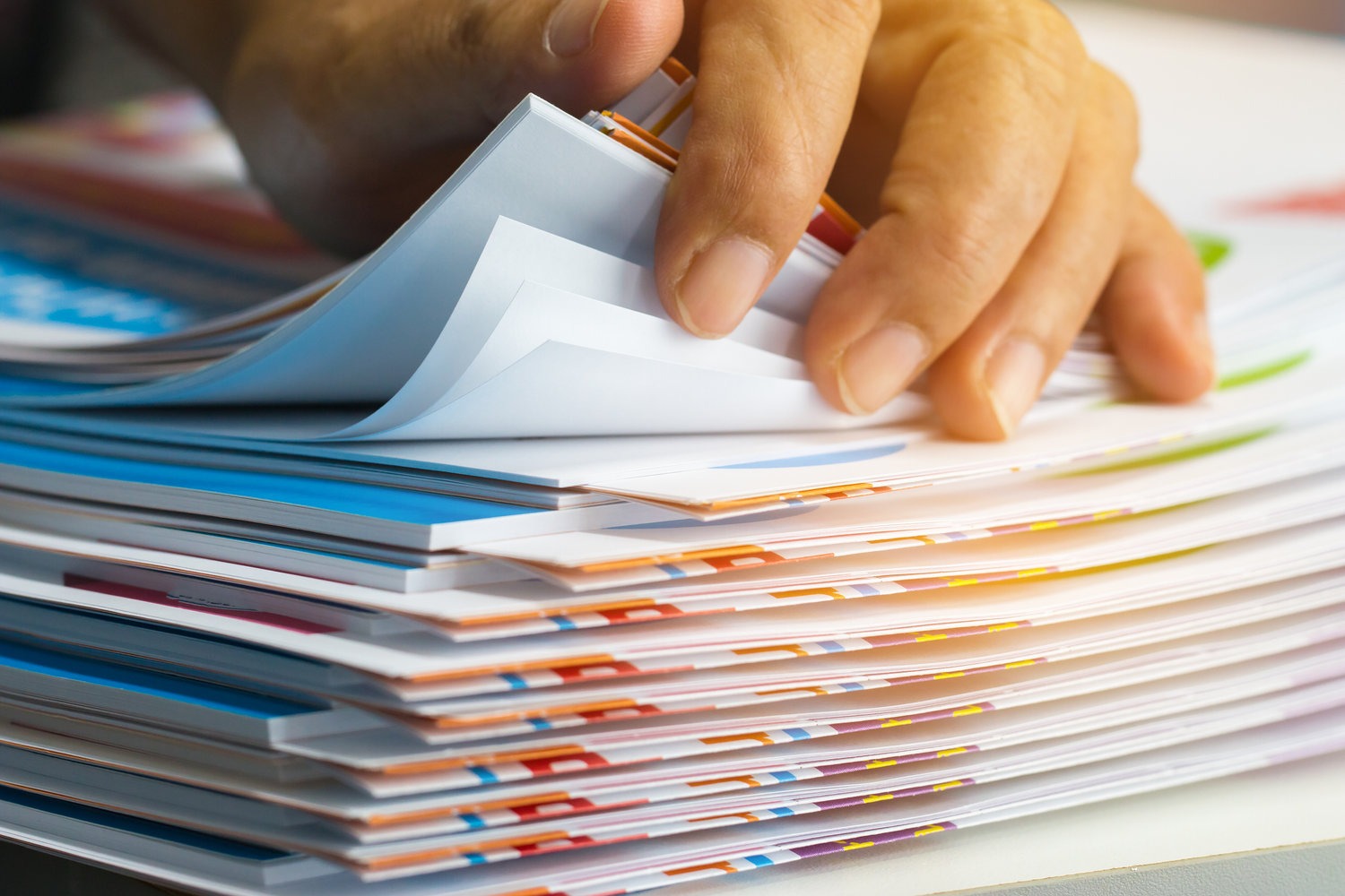<span  class="uc_style_uc_tiles_grid_image_elementor_uc_items_attribute_title" style="color:#ffffff;">Businessman hands searching unfinished documents stacks of paper files on office desk for report papers, piles of sheet achieves with clips on table, Document is written, drawn,presented.</span>